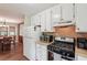 Bright kitchen with stainless steel appliances, connects to dining area at 3679 Regent Nw Dr, Kennesaw, GA 30144