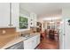 Open concept kitchen features stainless appliances, a diamond window, and dining area at 3679 Regent Nw Dr, Kennesaw, GA 30144