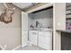 Convenient laundry room featuring a washer and dryer, with extra space for storage at 3679 Regent Nw Dr, Kennesaw, GA 30144