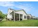 The home has a lovely backyard with a covered patio, well-manicured lawn, and wrought iron fence at 704 Fairlane Dr, Marietta, GA 30064