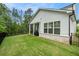 Spacious backyard with a covered patio ideal for outdoor dining and a well-maintained lawn, perfect for entertaining at 704 Fairlane Dr, Marietta, GA 30064