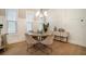 The dining room offers chandelier lighting, decorative wall panels, and a round table at 704 Fairlane Dr, Marietta, GA 30064