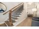Inviting home entryway featuring a staircase and views into the dining room at 704 Fairlane Dr, Marietta, GA 30064