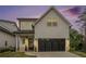 Beautiful home with an attached two-car garage, manicured lawn, and lovely front porch at 704 Fairlane Dr, Marietta, GA 30064