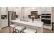 Kitchen featuring stainless steel appliances, a center island, white cabinets, and quartz counters at 704 Fairlane Dr, Marietta, GA 30064