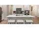 Clean kitchen with stainless steel appliances, quartz counters, and a center island at 704 Fairlane Dr, Marietta, GA 30064