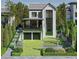 Stunning modern home features a landscaped front yard, two-car garage, and an elegant glass-enclosed entryway at 777 Brookridge Ne Dr, Atlanta, GA 30306