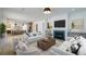 Open-concept living room features a fireplace, hardwood floors, and seamless access to the modern kitchen at 777 Brookridge Ne Dr, Atlanta, GA 30306