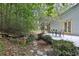 Serene backyard with stone path, water feature, and lush greenery at 20 Mahan Ne Ln, Rydal, GA 30171