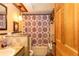 Charming bathroom boasting a shower-tub combination and vanity with unique sink basin at 20 Mahan Ne Ln, Rydal, GA 30171