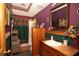 Well-lit bathroom featuring a large vanity, and bathtub with decorative curtain at 20 Mahan Ne Ln, Rydal, GA 30171