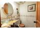 Charming bathroom featuring stone accents, a glass bowl sink, a wood toilet seat and picture frame at 20 Mahan Ne Ln, Rydal, GA 30171