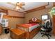 Inviting bedroom showcasing a storage bed frame and comfortable study area at 20 Mahan Ne Ln, Rydal, GA 30171