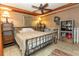 Cozy bedroom with tile floors, ceiling fan, shelves and a full-sized bed at 20 Mahan Ne Ln, Rydal, GA 30171