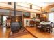 Log cabin dining room with wood burning stove and hardwood floors at 20 Mahan Ne Ln, Rydal, GA 30171
