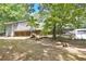 A secluded home with a wooded lot, a screened-in porch, and a detached garage at 20 Mahan Ne Ln, Rydal, GA 30171