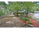 A secluded house with professional landscaping including small boulders and red mulch at 20 Mahan Ne Ln, Rydal, GA 30171