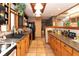 Long kitchen with wood cabinetry and ample countertop space at 20 Mahan Ne Ln, Rydal, GA 30171