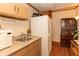 This kitchenette features a microwave, cabinets, sink and a refrigerator at 20 Mahan Ne Ln, Rydal, GA 30171