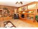 Cozy living room featuring a fireplace, tile floor, and built-in shelving at 20 Mahan Ne Ln, Rydal, GA 30171