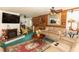 Bright living room offering a decorative fireplace, hardwood floors, neutral paint and a ceiling fan at 20 Mahan Ne Ln, Rydal, GA 30171