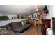 Spacious living room featuring wood floors, chandelier, a comfortable couch, and unique rustic decor at 20 Mahan Ne Ln, Rydal, GA 30171