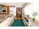 Open concept living room with sliding barn door, stone accent wall, and plenty of natural light at 20 Mahan Ne Ln, Rydal, GA 30171
