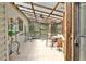 Bright sunroom with a transparent roof, tile flooring, natural light, and comfortable seating at 20 Mahan Ne Ln, Rydal, GA 30171