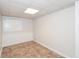 Finished basement area with tile flooring and white wainscoting at 2636 Suzanne Ln, Acworth, GA 30102