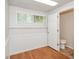 Finished basement space featuring laminate flooring, a window, and a doorway with a bathroom at 2636 Suzanne Ln, Acworth, GA 30102