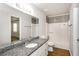 Bright bathroom features a granite countertop and a shower over tub combination at 2636 Suzanne Ln, Acworth, GA 30102