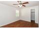Bright bedroom featuring hardwood floors, a ceiling fan, and a closet at 2636 Suzanne Ln, Acworth, GA 30102
