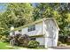 Two story home with siding, mature trees, a 2-car garage and greenery at 2636 Suzanne Ln, Acworth, GA 30102