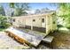 Exterior view of home showcasing a large wooden deck with a seating area at 2636 Suzanne Ln, Acworth, GA 30102