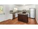 Modern kitchen featuring stainless steel appliances, an island, and sleek countertops at 2636 Suzanne Ln, Acworth, GA 30102