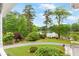 A backyard with a lake view and lush greenery that provides tranquility at 3109 Country Lake Dr, Powder Springs, GA 30127