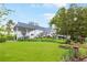 Expansive backyard with lush lawn and a beautifully landscaped garden at 3109 Country Lake Dr, Powder Springs, GA 30127