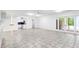 A spacious basement with tile flooring, white walls, and access to the backyard at 3109 Country Lake Dr, Powder Springs, GA 30127