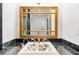 Unique bathroom vanity with a decorative sink and custom-designed mirror at 3109 Country Lake Dr, Powder Springs, GA 30127