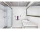 Bright bathroom features a shower, decorative ceiling tiles, and white subway tile walls at 3109 Country Lake Dr, Powder Springs, GA 30127