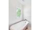 Bathroom with tub and a window at 3109 Country Lake Dr, Powder Springs, GA 30127