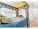 Bedroom featuring a blue and yellow canopy bed and access to walk-in closet at 3109 Country Lake Dr, Powder Springs, GA 30127
