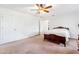 Bedroom with a bed, doors to other rooms, and ceiling fan at 3109 Country Lake Dr, Powder Springs, GA 30127