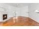Bedroom with decorative fireplace, ceiling fan, and hardwood flooring at 3109 Country Lake Dr, Powder Springs, GA 30127