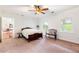 Bedroom with a bed, windows, and open doorway to another room at 3109 Country Lake Dr, Powder Springs, GA 30127