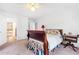 Bedroom with bed, side table, and an open doorway to a hall at 3109 Country Lake Dr, Powder Springs, GA 30127