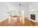 Bright bedroom with a fireplace, hardwood floors, and access to both a bathroom and balcony at 3109 Country Lake Dr, Powder Springs, GA 30127