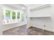 Bright bonus room featuring a window seat, view of nature, tile floor, and open closet space at 3109 Country Lake Dr, Powder Springs, GA 30127