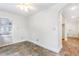 Bright bonus room featuring a tiled floor, open archways, and access to other spaces at 3109 Country Lake Dr, Powder Springs, GA 30127