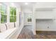 Bright bonus room featuring a window seat, view of nature, tile floor, and adjacent open closet at 3109 Country Lake Dr, Powder Springs, GA 30127